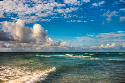 View of calm sea against cloudy sky