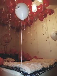 Close-up of balloons hanging on table