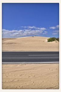 Scenic view of landscape against cloudy sky