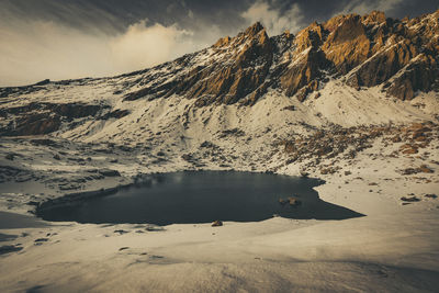 Scenic view of snowcapped mountains against sky during winter