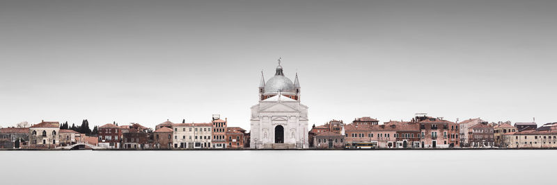 Buildings in city against sky