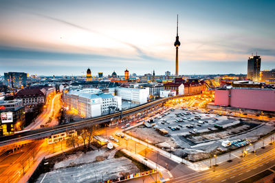 High angle view of city street and buildings against sky