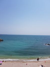 Scenic view of sea against clear blue sky