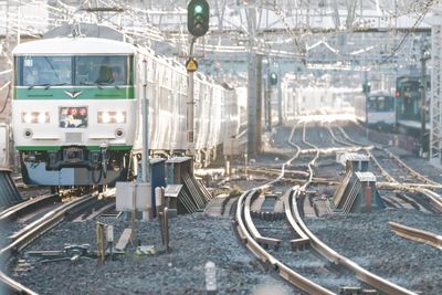 Train on railroad tracks in city