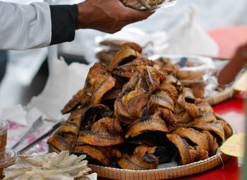 Midsection of man preparing food