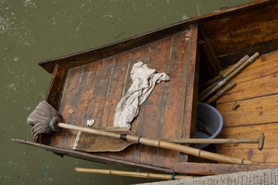 Boat against wooden post in water