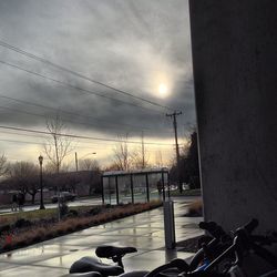 View of street light against cloudy sky