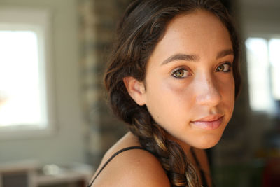 Close-up portrait of smiling young woman