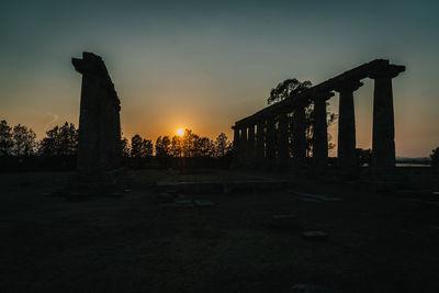 Silhouette of historical building during sunset