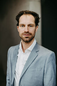 Portrait of businessman standing in office