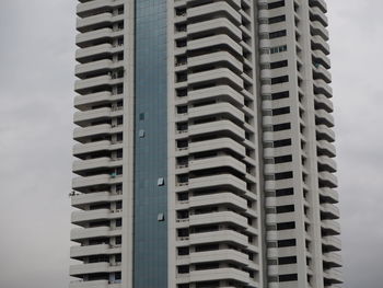 Low angle view of modern buildings against sky