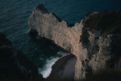 High angle view of rocks by sea