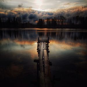 Scenic view of lake against sky during sunset