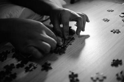 Close-up of hands playing on table