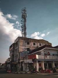 Street by building against sky