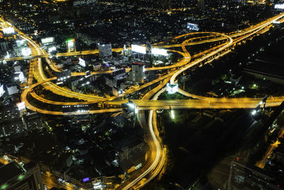 High angle view of light trails on city street at night