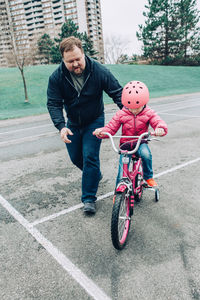 Man riding bicycle on road