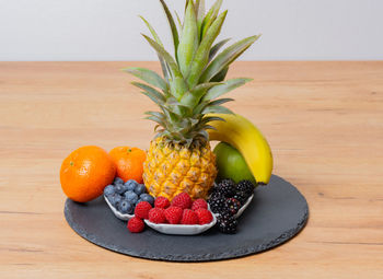 Close-up of pineapple in plate on table