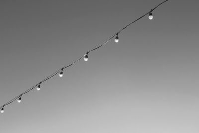 Low angle view of lighting equipment against clear sky