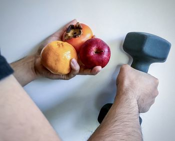 High angle view of man holding apple