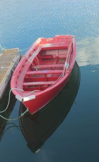 High angle view of red boat moored at lake