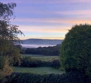 Scenic view of landscape against sky during sunset