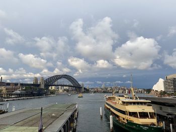 View of bridge over river against cloudy sky