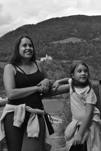 Portrait of a smiling young woman on land