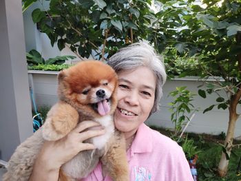 Portrait of woman with dog