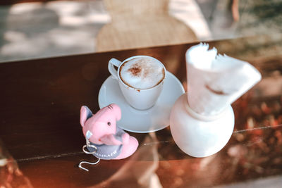 High angle view of coffee cup on table