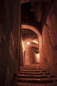 Narrow corridor along old building