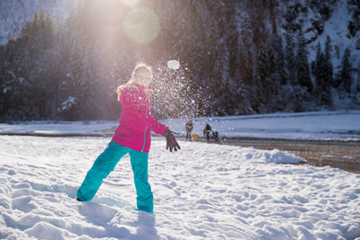 Full length of woman on snow covered landscape during winter
