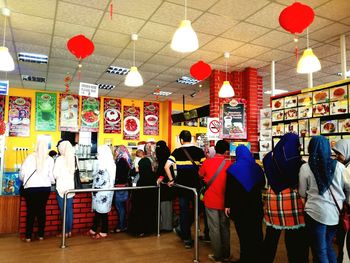 Group of people standing in store