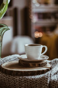Close-up of coffee cup on table
