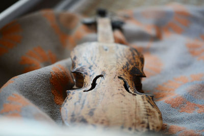 Close-up of rusty metal on wood