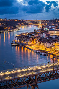 High angle view of illuminated bridge over river against sky