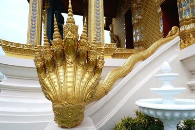 Statue of temple outside building