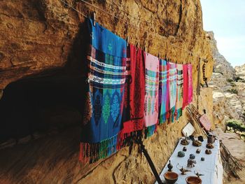 Clothes drying on rock against wall