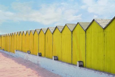 Beach huts against sky