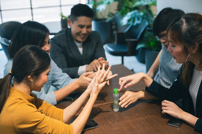 Group of people sitting in the table