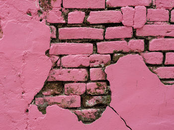 The textured pink wall