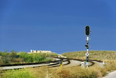 Railway tracks along countryside landscape