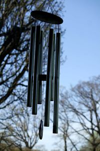 Low angle view of electric lamp hanging on roof