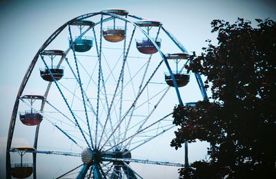 Low angle view of ferris wheel against sky