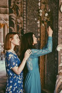 Two young woman in old building