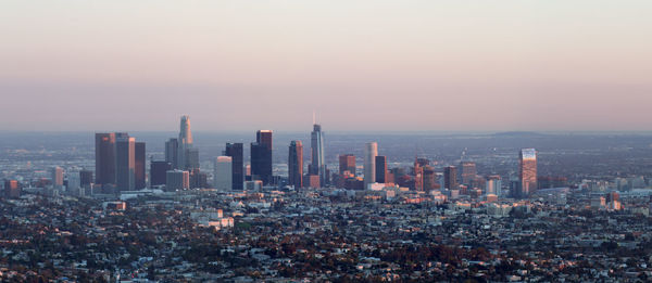 View of cityscape against sky during sunset