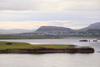 Scenic view of lake and mountains against sky