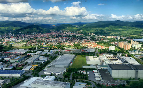 Cityscape against cloudy sky