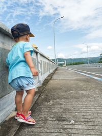 Full length rear view of woman against sky