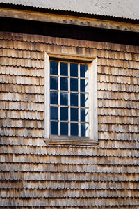 Low angle view of window on wall of building